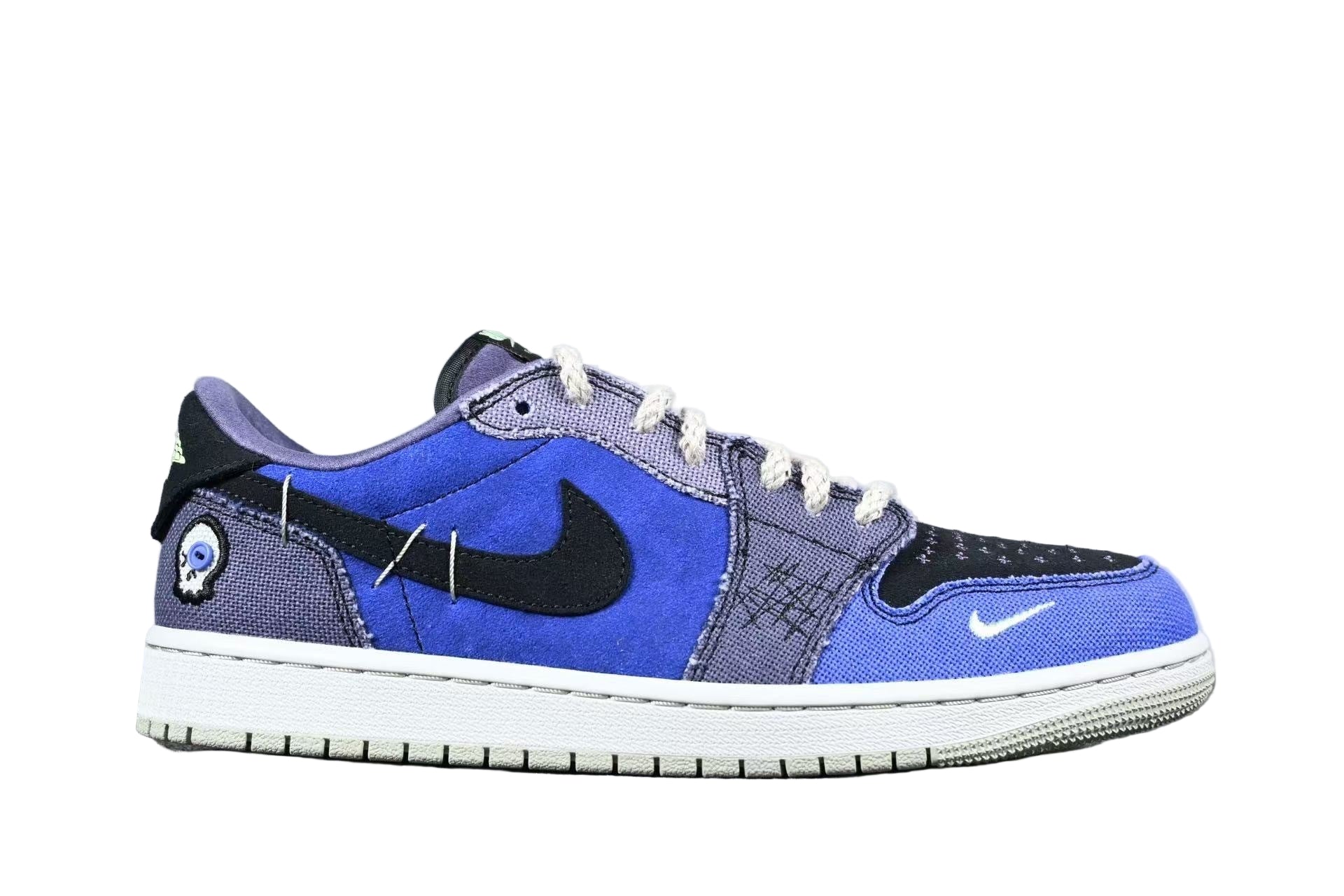 Blue and gray sneaker with a Nike logo on a gray background