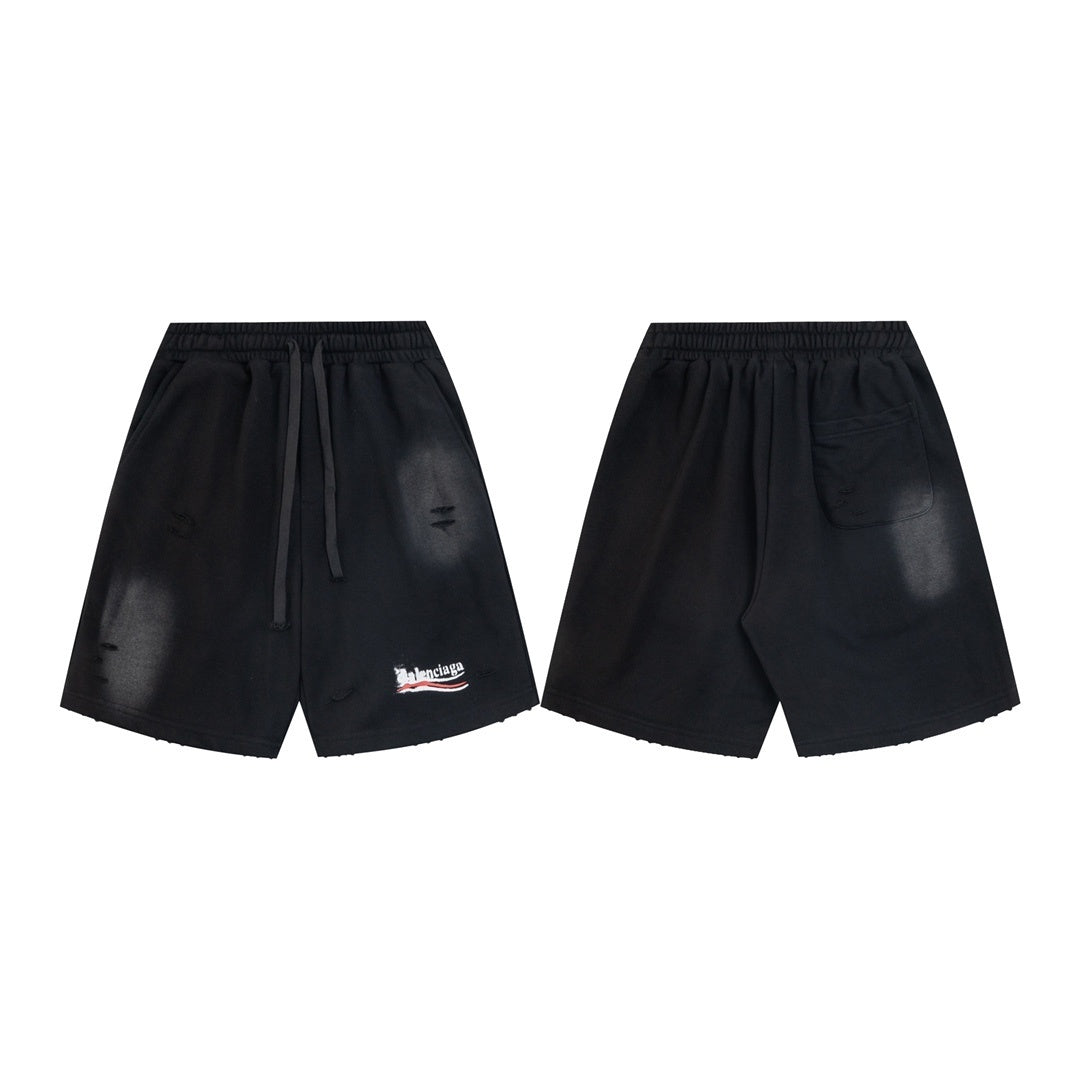 balenciaga Black shorts with a brand logo on a white background