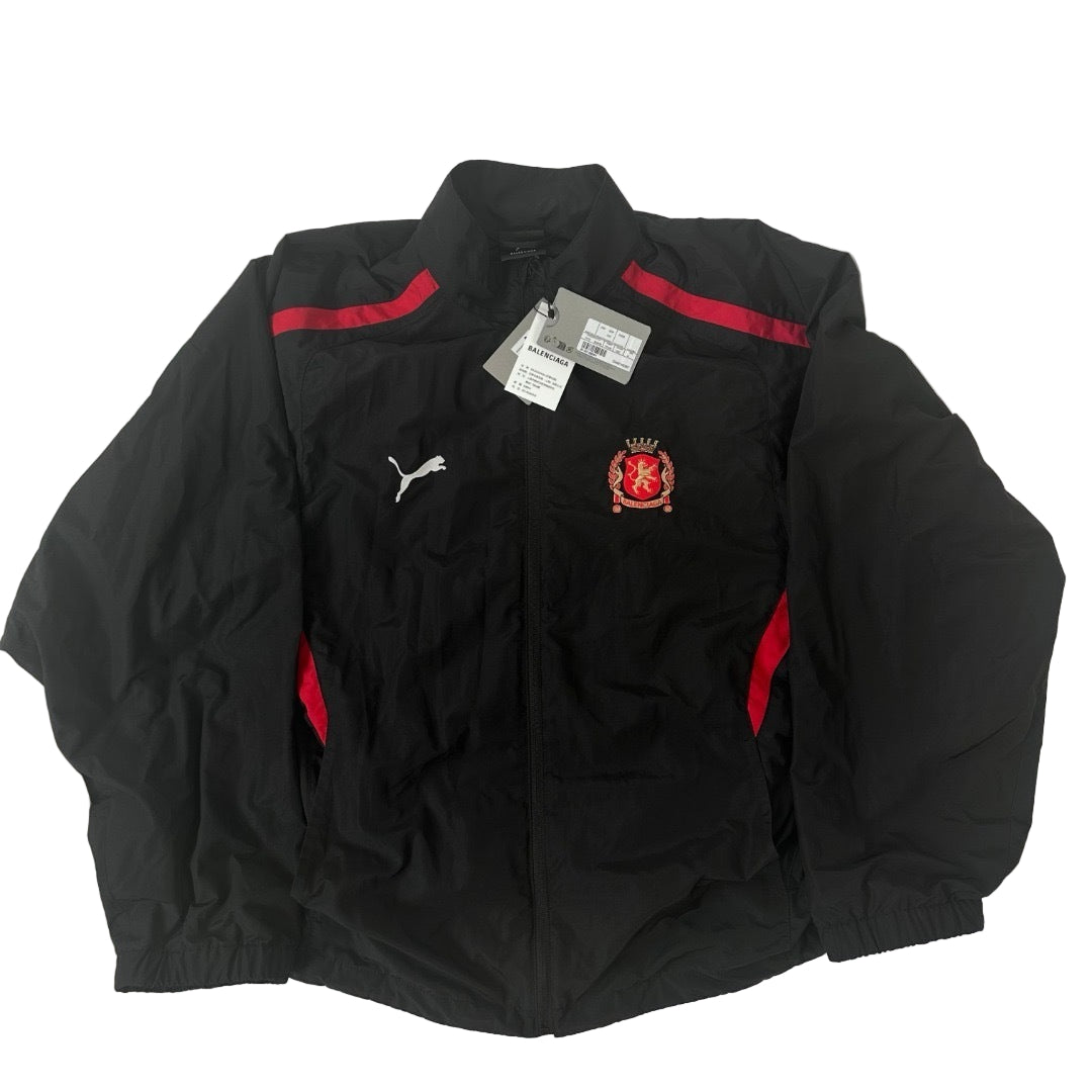 Black jacket with red accents and a visible brand logo on a white background