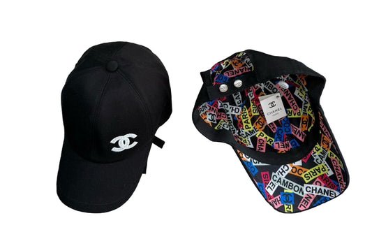 Black Chanel cap and colorful cap with brand logos on a textured surface