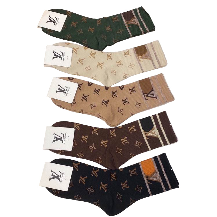 Four pairs of socks with brand logos on a white surface