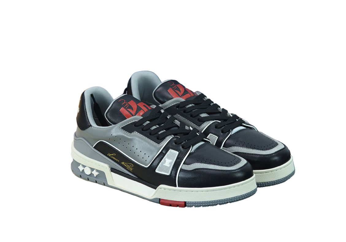Black and gray sneakers with red accents on a white background