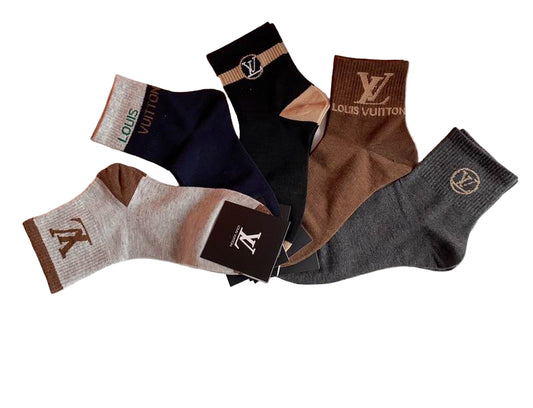 Set of Louis Vuitton socks in various colors with a branded box on a white background.