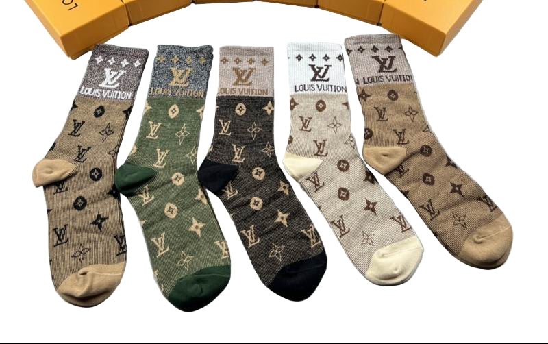Louis Vuitton socks with branded boxes on a gray background