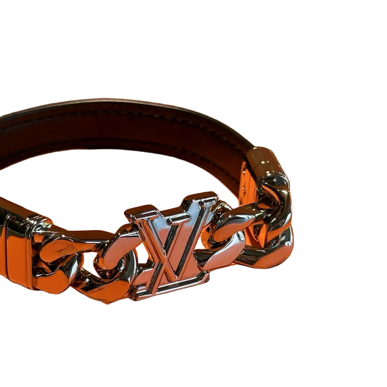 Silver chain bracelet with 'LV' logo on an orange background