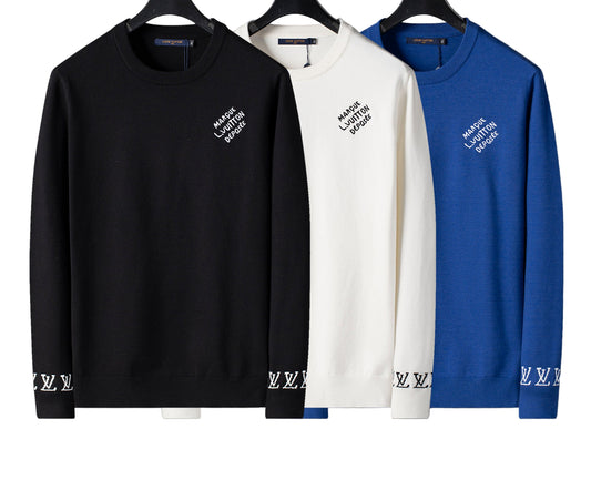 Black, white, and blue long-sleeve shirts with brand logo on a gray background