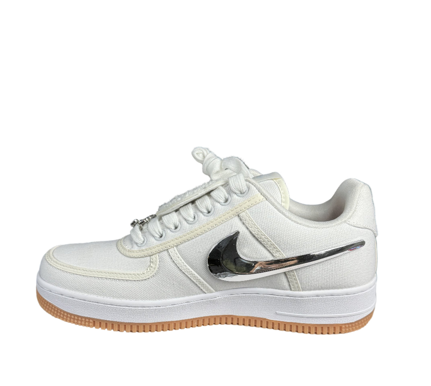 White sneaker with a black swoosh logo on a white box with 'Top Made' sign, black background