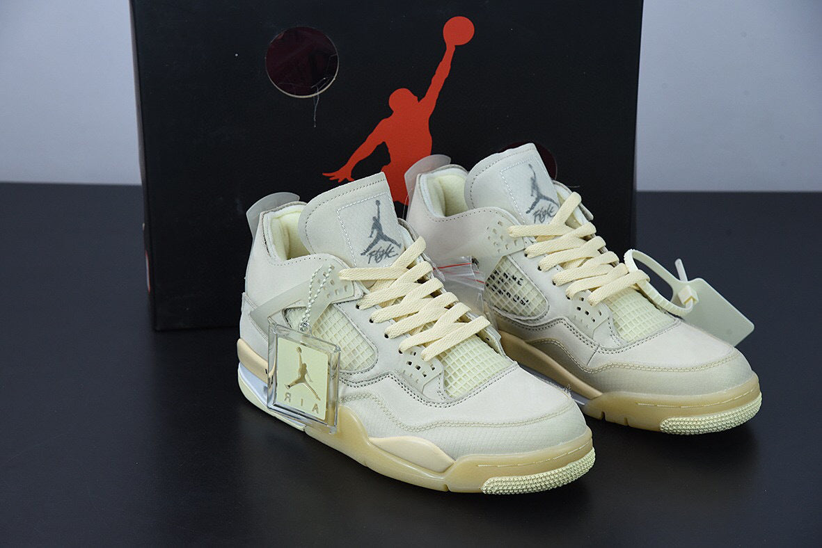 Light-colored sneakers with a prominent brand logo on a dark background