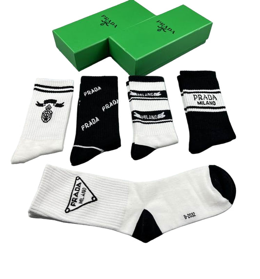 Set of Prada socks with a green box on a gray background