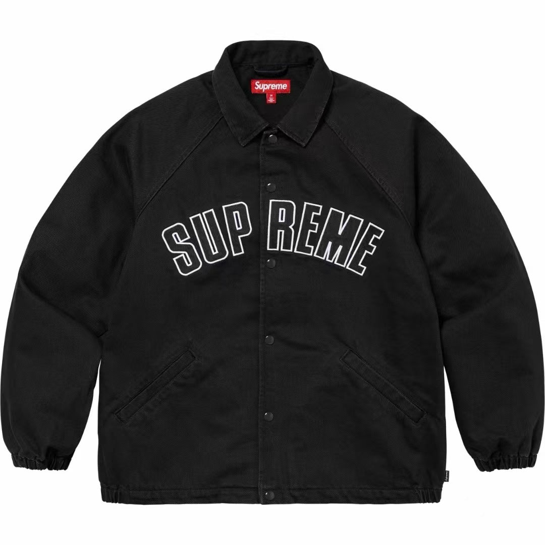 Supreme Arc Logo black coaches jacket with bold white arc lettering “SUPREME” across the chest, displayed flat on white background.