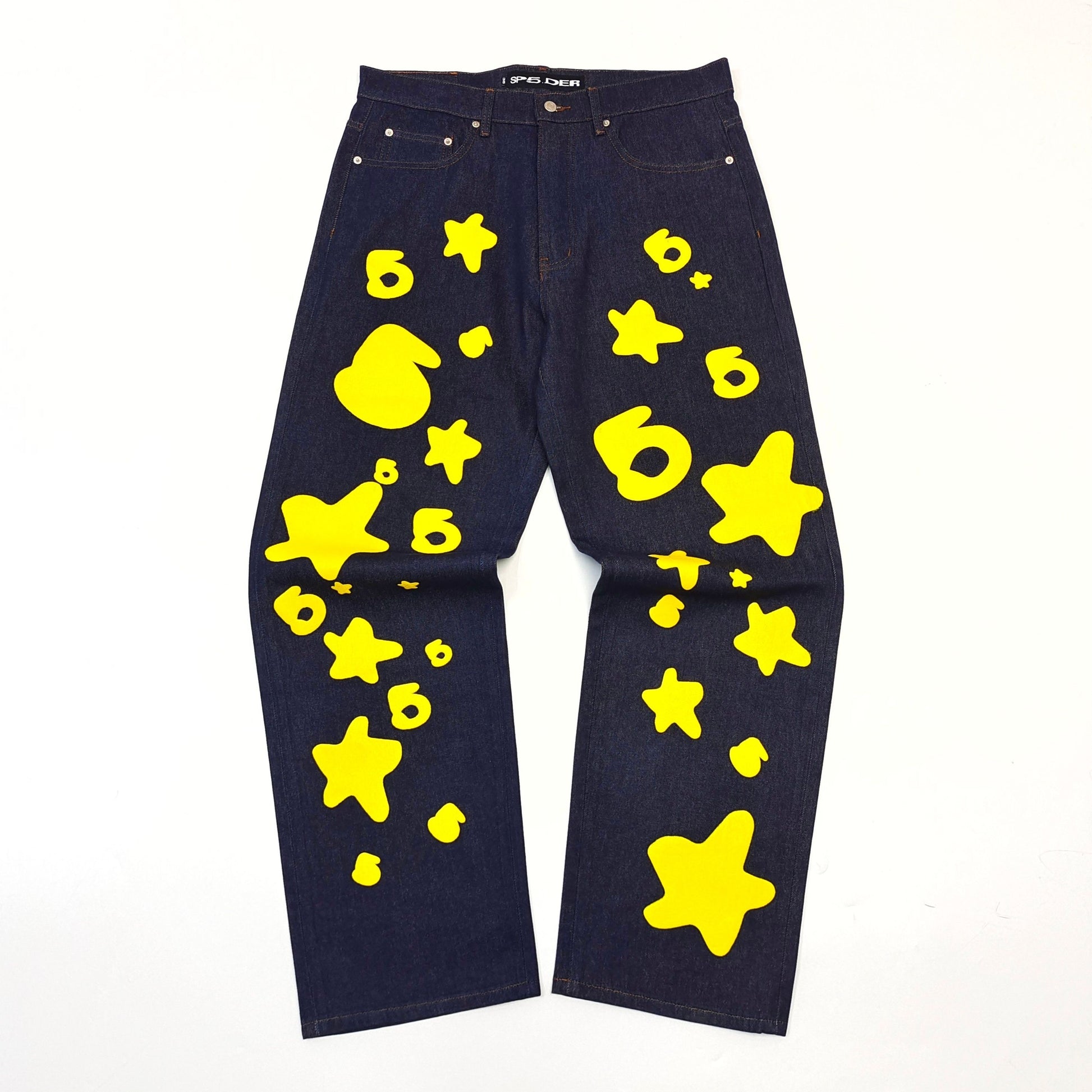 Sp5der Black jeans with yellow star patterns on a white background