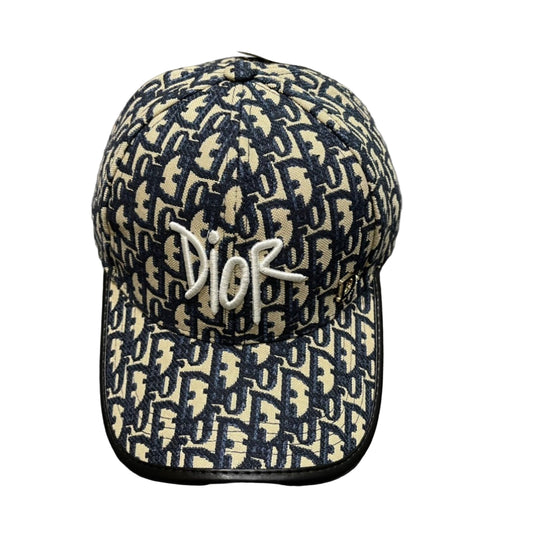 Dior cap with logo on a gray surface