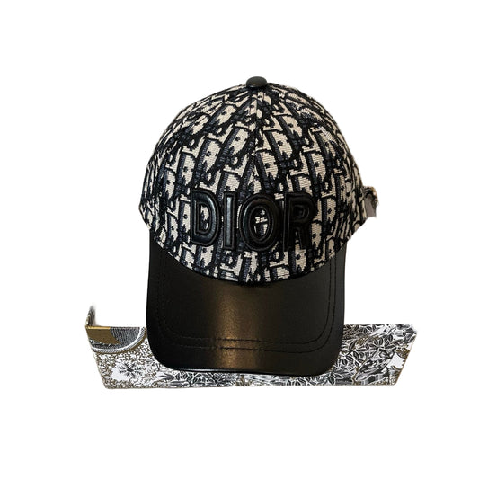 Dior cap with black and white pattern on a beige surface