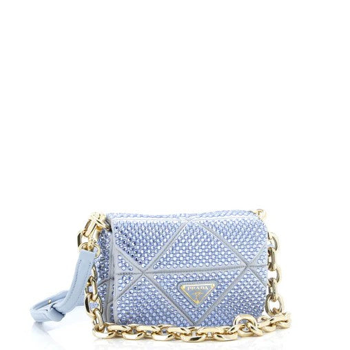 Light blue handbag with gold chain strap on a white background