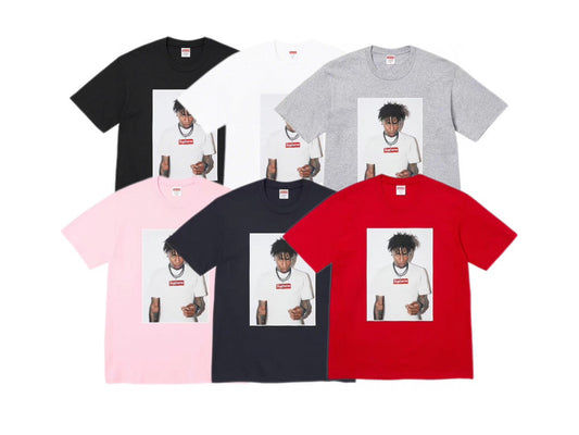 Supreme NBA YoungBoy black photo tee featuring YoungBoy wearing a white Supreme box logo shirt, displayed on flat white background.