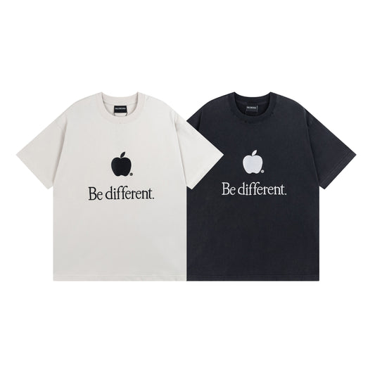 Two t-shirts, one white and one black, with apple logos and 'Be different' text.