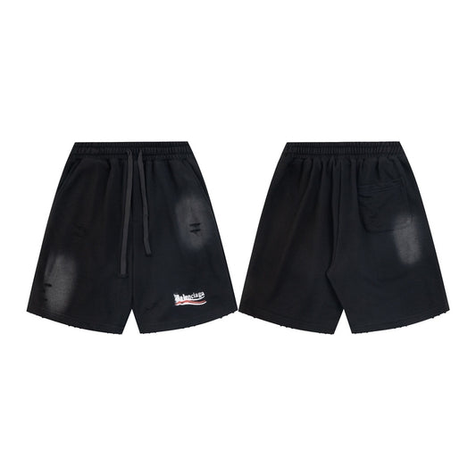 balenciaga Black shorts with a brand logo on a white background