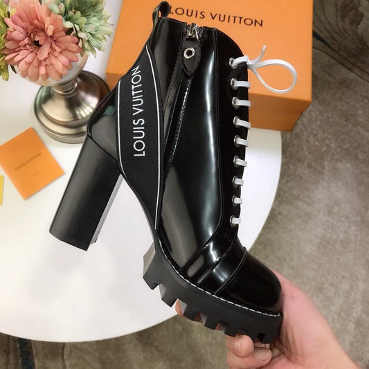 Louis Vuitton | Star Trail Patent Leather Ankle Boots | Black