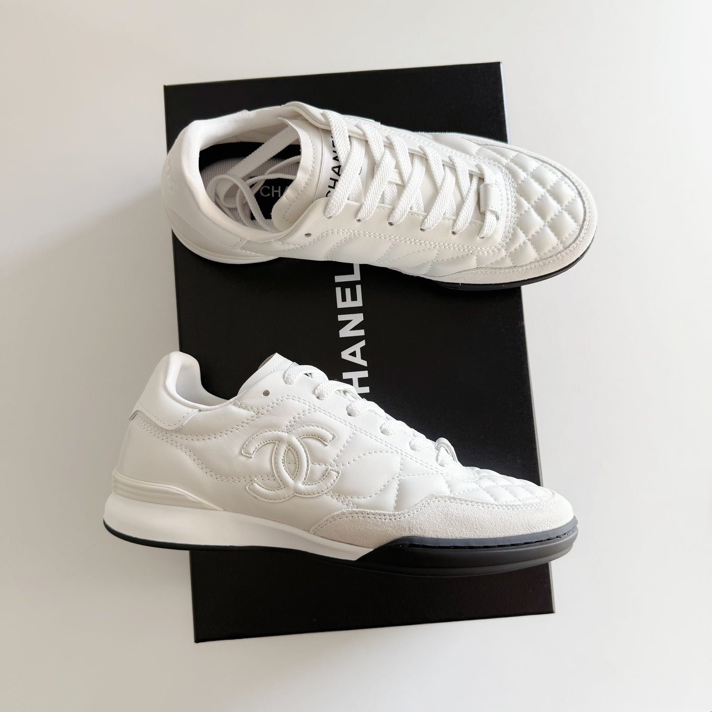 Chanel | CC Logo Sneakers | White or Black Colorways