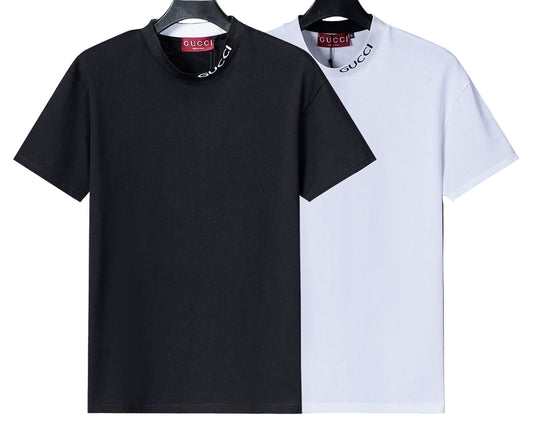 Black and white t-shirts with Gucci logo on hangers against a gray background