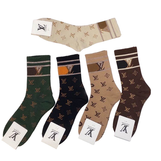 Set of patterned socks with brand labels on a white surface