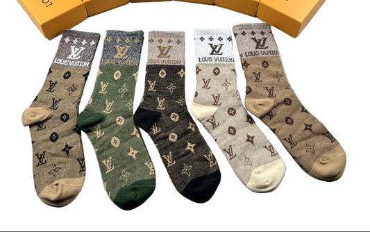 Louis Vuitton socks with branded boxes on a gray background