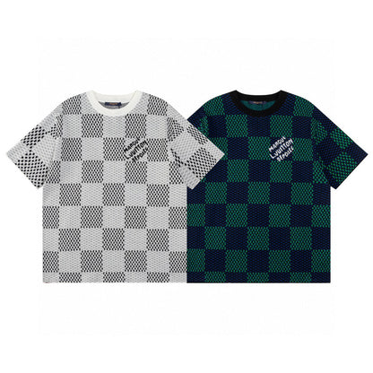 Two checkered shirts, one white and black patterned, the other green and black patterned, on a white background.