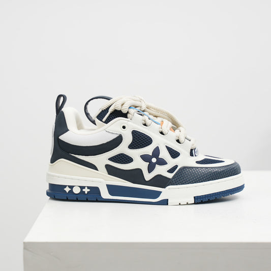 White and blue sneaker with floral design on a light gray background