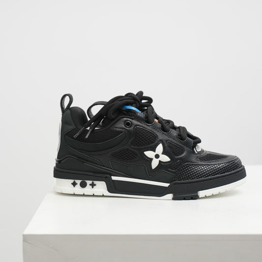 lv Black sneaker with a white flower design on a light gray background