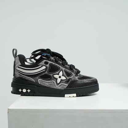 lv Black and gray sneaker with floral design on a white platform against a light gray background