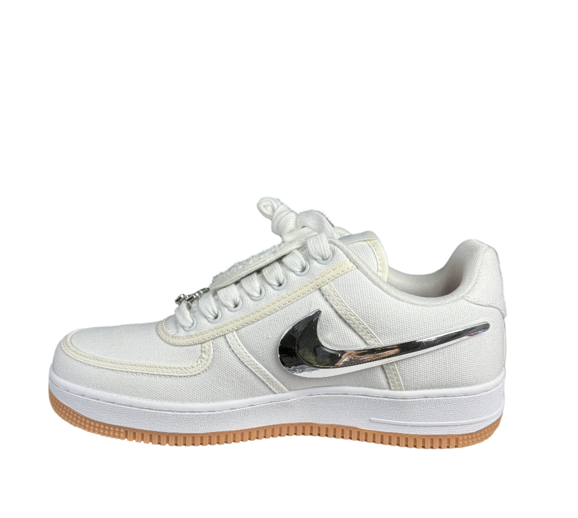 White sneaker with a black swoosh logo on a white box with 'Top Made' sign, black background