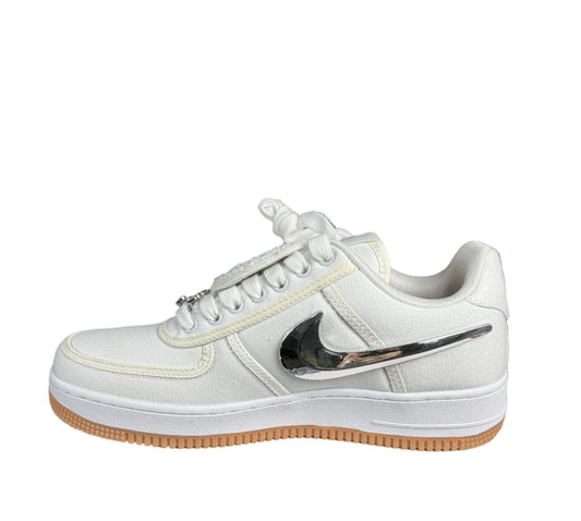 White sneaker with a black swoosh logo on a white box with 'Top Made' sign, black background