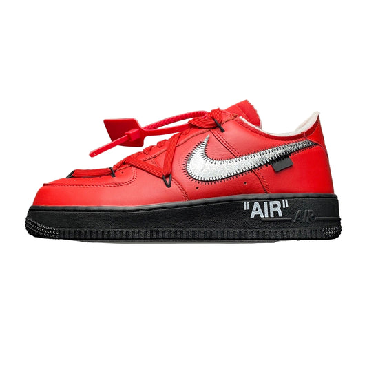 Red sneaker with black sole and 'Off-White' branding on a metallic surface.
