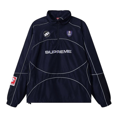 Navy blue jacket with white accents and Supreme logo on a white background