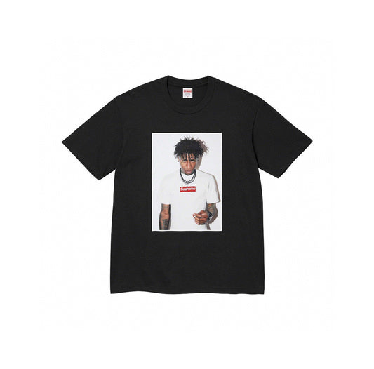Supreme NBA YoungBoy black photo tee featuring YoungBoy wearing a white Supreme box logo shirt, displayed on flat white background.
