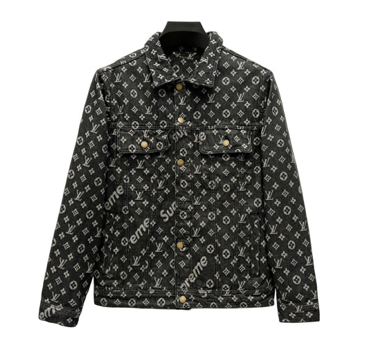 Supreme x Louis Vuitton monogram denim jacket in black with all-over LV and Supreme logo pattern, displayed on a hanger against a white background.