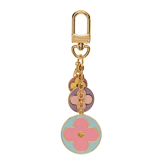 Colorful floral keychain with gold clasp on a white background